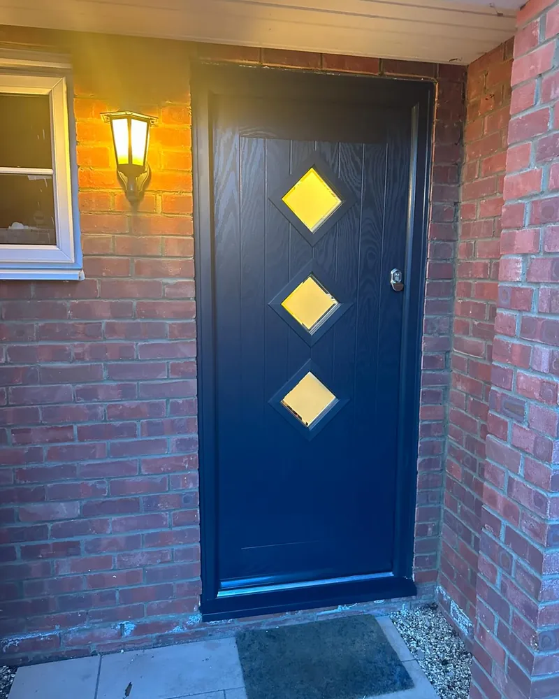 Navy blue composite front door with three diamond glazed panels